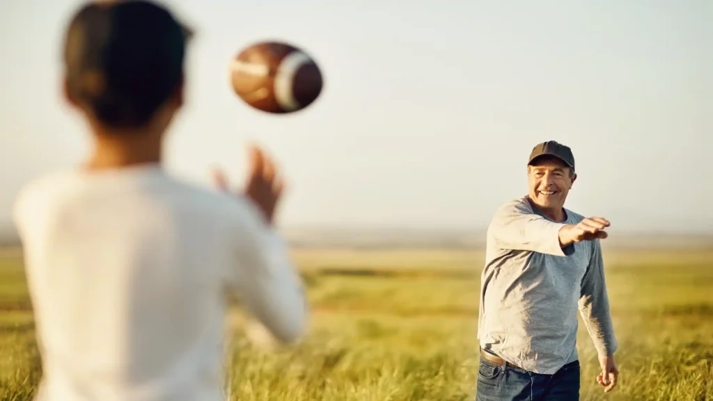 Raleigh Hand to Shoulder Center Photo of man playing football